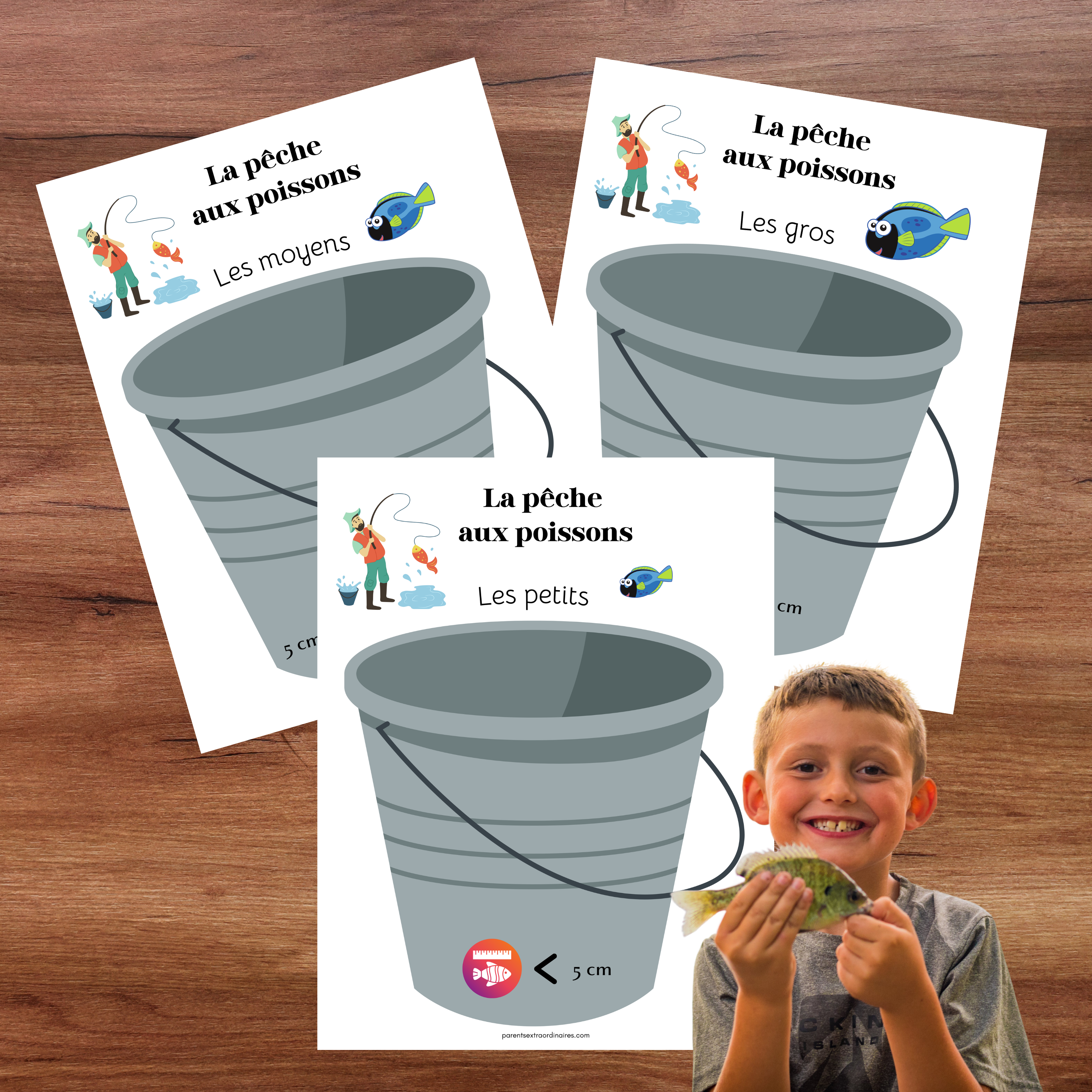 Jeu éducatif où l’enfant dépose les poissons dans le bon seau selon leur taille.
